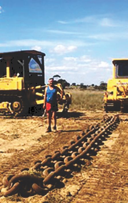 about marty grant page - marty in front of drag chain and heavy plant machinery